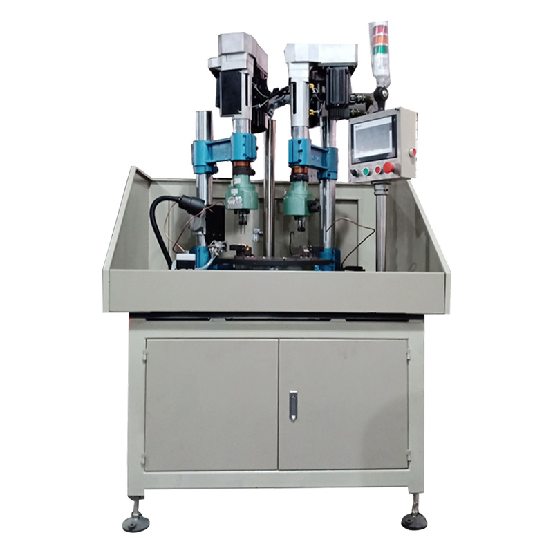 Four-station multi-axis punching, chamfering and tapping machine